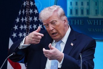 Donald Trump speaking during discussions linked to Iran negotiations and concerns about the United States economy. ```0